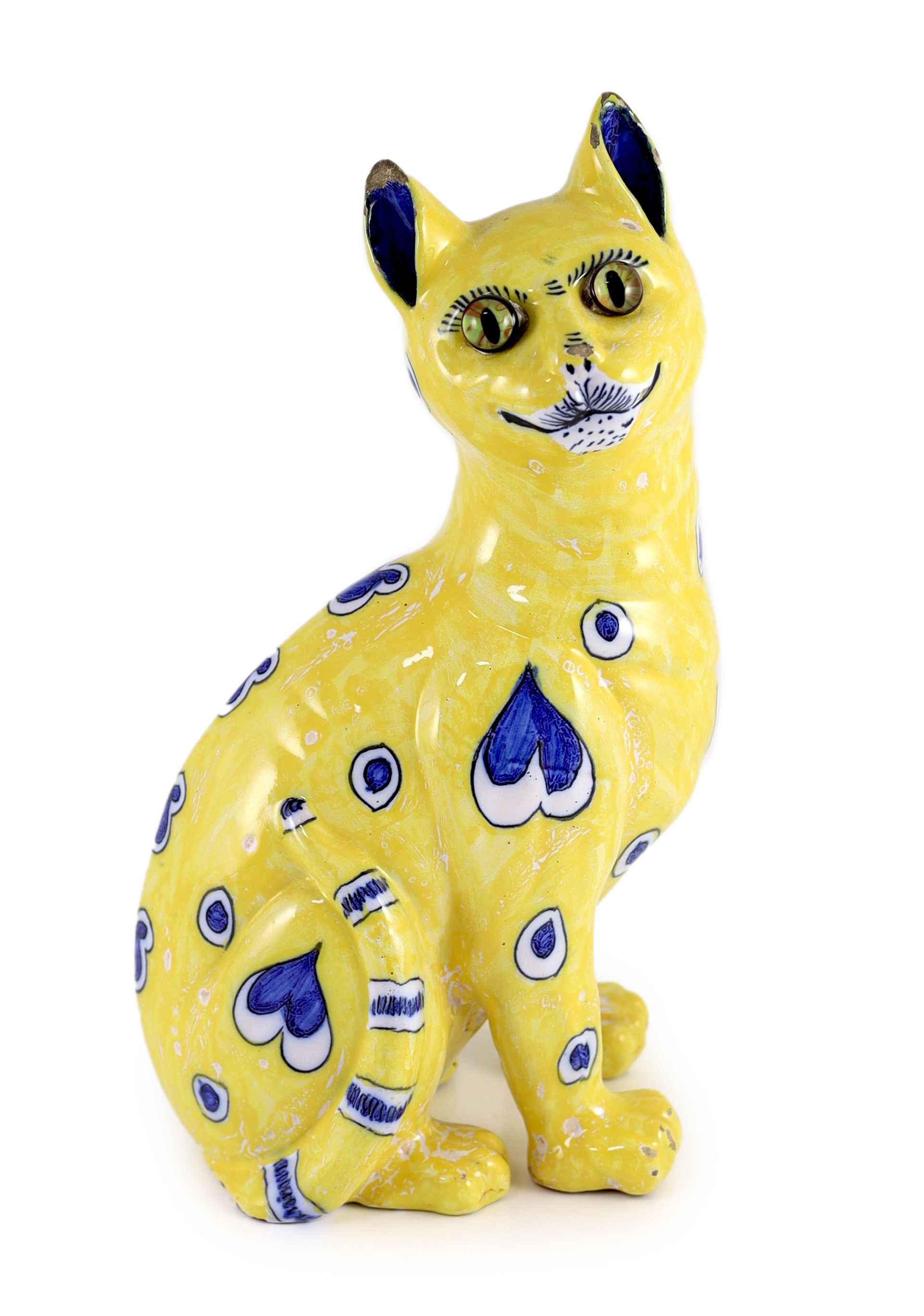 A Gallé yellow faience model of a seated smiling cat, c.1885, 33cm high, small faults